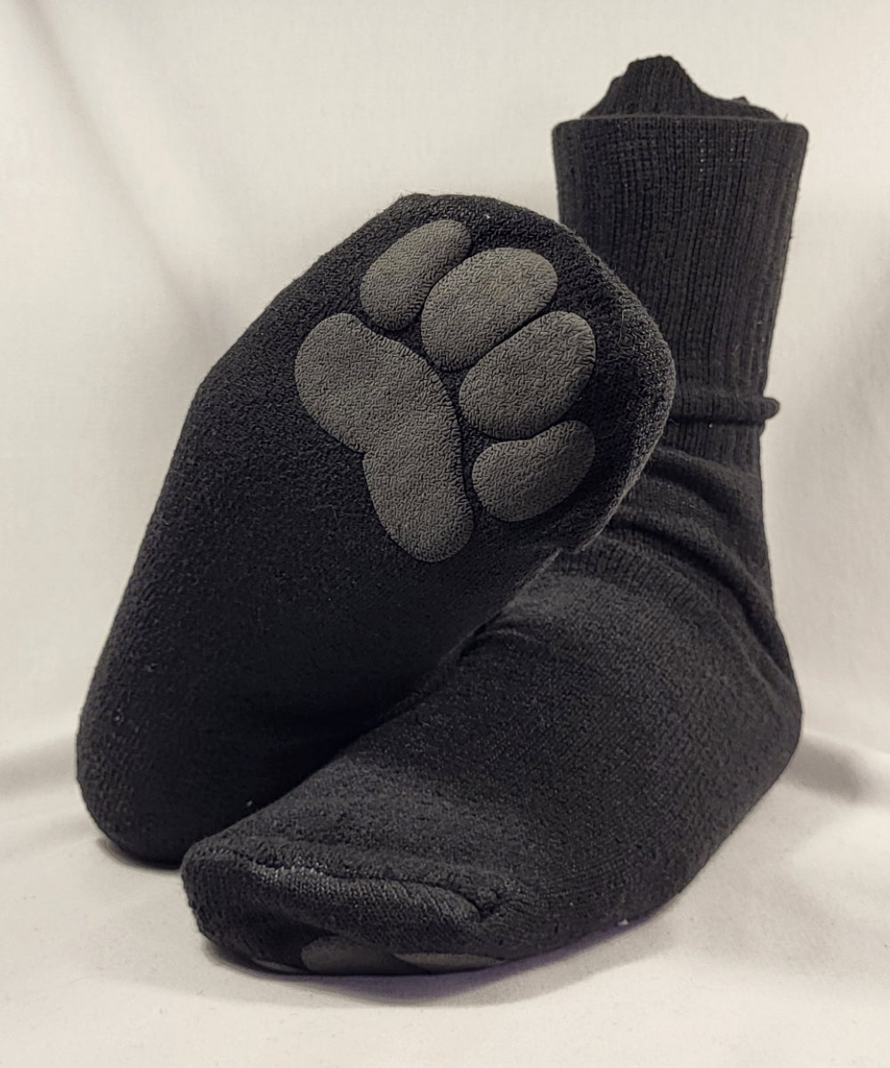 Black toe-separated socks with paw print design on a light gray background